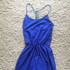 Blue jumpsuit with criss-cross back straps